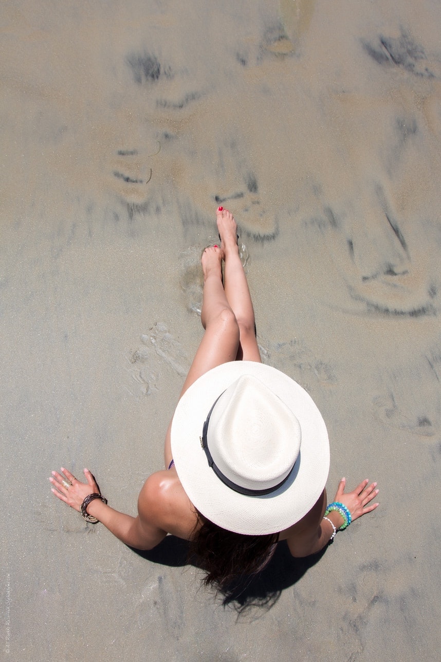 Wearing a hat at the beach - Visit Stylishlyme to view more pictures and see why you need a pretty summer printed bikini!